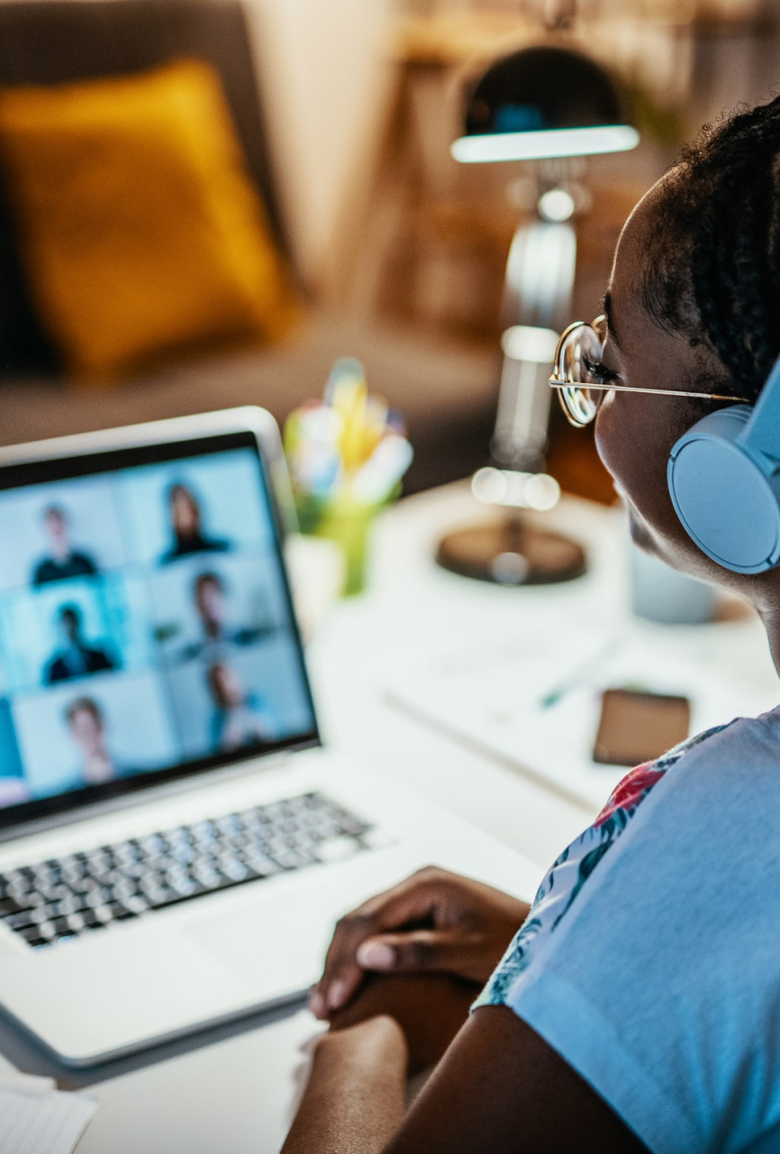 Professionals in a corporate training room working on laptops, following a Microsoft Office workshop (Excel, Word, PowerPoint), instructor guiding them, formal business setting. min